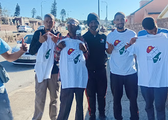 ETM supporters wearing branded T-shirts on the street