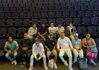 ETM team seated in an auditorium