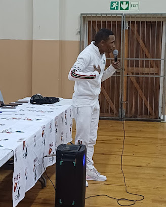 Speaker addressing members at an indoor event